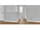 Bright hallway features wood floors, staircase with white trim, and natural light from the window at 1017 Marsh Royal St, Summerville, SC 29485