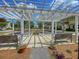 Tranquil pergola seating area with benches, providing a shady spot to relax and enjoy the outdoors at 1017 Marsh Royal St, Summerville, SC 29485