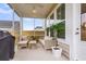 Screened-in porch featuring patio furniture, a ceiling fan, and a potted plant at 1017 Marsh Royal St, Summerville, SC 29485