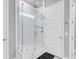 Modern shower with glass enclosure, rainfall shower head, and built-in shelves at 1017 Marsh Royal St, Summerville, SC 29485