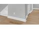 Close-up shot of clean base trim and paint, with hardwood floors, and a white door that shows the house's detailing at 1017 Marsh Royal St, Summerville, SC 29485