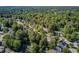 An aerial shot of the property within a tranquil community with ample greenery, showcasing a peaceful and secluded environment at 105 Moon Shadow Ln, Summerville, SC 29485