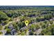 Aerial view of a charming home nestled in a lush, green community with mature trees and well-maintained lawns at 105 Moon Shadow Ln, Summerville, SC 29485