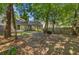 The home has a shady backyard with mature trees and a privacy fence at 105 Moon Shadow Ln, Summerville, SC 29485