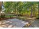 This home features a backyard patio with mature trees, a privacy fence, and plantings at 105 Moon Shadow Ln, Summerville, SC 29485