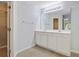 Bright bathroom with double vanity, large mirror, and an open closet at 105 Moon Shadow Ln, Summerville, SC 29485