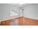 Bright bedroom with wood-look floors, a large window, and white walls at 105 Moon Shadow Ln, Summerville, SC 29485