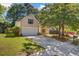 Charming home with attached two-car garage, mature trees, and well-manicured lawn at 105 Moon Shadow Ln, Summerville, SC 29485