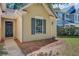 Charming home features a dark front door and meticulously maintained landscaping with pine straw at 105 Moon Shadow Ln, Summerville, SC 29485