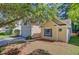 Charming home featuring a two-car garage, mature tree, and well-maintained lawn with pine straw at 105 Moon Shadow Ln, Summerville, SC 29485
