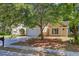 Charming home boasts mature trees, a two-car garage, and a well-kept lawn with pine straw at 105 Moon Shadow Ln, Summerville, SC 29485