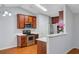 Bright kitchen featuring stainless appliances, white counters, and brown cabinetry at 105 Moon Shadow Ln, Summerville, SC 29485