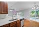 Bright kitchen with stainless steel appliances, laminate flooring, and plenty of natural light at 105 Moon Shadow Ln, Summerville, SC 29485