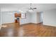Open-concept living room featuring hardwood floors and a ceiling fan for comfortable living at 105 Moon Shadow Ln, Summerville, SC 29485