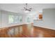 Open-concept living area with hardwood floors, abundant natural light, and seamless flow to the kitchen at 105 Moon Shadow Ln, Summerville, SC 29485