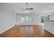 Open living space featuring hardwood floors, large windows, and a modern ceiling fan at 105 Moon Shadow Ln, Summerville, SC 29485