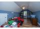 Spacious attic with hardwood floors, built-in shelves, and a cozy atmosphere at 105 Northpark Ave, Summerville, SC 29485