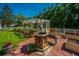 Backyard featuring lush landscaping, a wishing well feature, and a well-manicured lawn at 105 Northpark Ave, Summerville, SC 29485