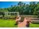 Charming backyard with lush landscaping, a wishing well feature and a well-manicured lawn at 105 Northpark Ave, Summerville, SC 29485