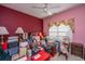 Bedroom with a window and a ceiling fan, offering a cozy and comfortable space at 105 Northpark Ave, Summerville, SC 29485