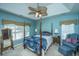 Elegant bedroom with four poster bed, ceiling fan, and lots of natural light at 105 Northpark Ave, Summerville, SC 29485