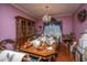 Dining room featuring a wooden table overloaded with decorations, plus a chandelier and hardwood floors at 105 Northpark Ave, Summerville, SC 29485