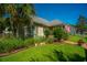 Charming home featuring a lush front yard, well-manicured landscaping, and a welcoming facade at 105 Northpark Ave, Summerville, SC 29485