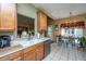 Charming kitchen with bright cabinets, stainless steel appliances, and a view to the dining area at 105 Northpark Ave, Summerville, SC 29485