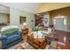 Cozy living room with comfortable seating, warm colors, and a view into the dining area at 105 Northpark Ave, Summerville, SC 29485