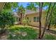 A view of the home's yard, landscaping, and exterior at 106 Sago Palm Ct, Summerville, SC 29483