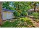 A view of the backyard featuring the shed and landscaping at 106 Sago Palm Ct, Summerville, SC 29483