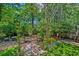 Backyard with garden and potted plants at 106 Sago Palm Ct, Summerville, SC 29483