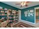 Bedroom featuring built-in bookshelves, a ceiling fan, carpet and furnishings at 106 Sago Palm Ct, Summerville, SC 29483