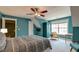 Bedroom with carpeted floor, sitting area, ceiling fan and window at 106 Sago Palm Ct, Summerville, SC 29483