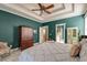 Bedroom features a tray ceiling and ensuite bathroom at 106 Sago Palm Ct, Summerville, SC 29483