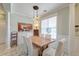 Bright dining room with white plank floors, elegant lighting, and stylish decor at 106 Sago Palm Ct, Summerville, SC 29483