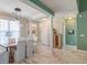 Bright dining room with white plank floors, elegant lighting, and stylish decor at 106 Sago Palm Ct, Summerville, SC 29483