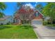 Charming brick home with a manicured front yard and a two-car garage at 106 Sago Palm Ct, Summerville, SC 29483