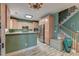 An eat-in kitchen features natural wood cabinets, stainless appliances, and a staircase at 106 Sago Palm Ct, Summerville, SC 29483