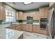 Kitchen boasts quartz counters, stainless appliances, ample cabinet space and a window over the sink at 106 Sago Palm Ct, Summerville, SC 29483