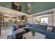 Spacious living area with fireplace, large sectional sofa, and seamless flow to dining and kitchen areas at 106 Sago Palm Ct, Summerville, SC 29483
