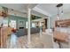 Open-concept living space with a fireplace, high ceilings, wood floors, and lots of natural light at 106 Sago Palm Ct, Summerville, SC 29483