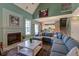 Spacious living room with a fireplace, a cozy sectional couch, and an open floor plan at 106 Sago Palm Ct, Summerville, SC 29483