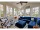 Bright sun room featuring a vaulted ceiling, an accent wall and comfortable seating at 106 Sago Palm Ct, Summerville, SC 29483