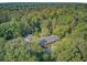 An aerial view of a wooded home with mature trees on a lush lot at 108 E Walker Dr, Summerville, SC 29483