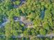 Expansive estate with lush greenery, tennis court and mature trees at 108 E Walker Dr, Summerville, SC 29483