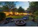 Beautiful backyard with fire pit and patio furniture, perfect for entertaining at 108 E Walker Dr, Summerville, SC 29483