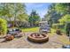 Spacious backyard with a fire pit, patio, and ample seating, great for gatherings at 108 E Walker Dr, Summerville, SC 29483