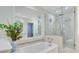 This bathroom features a tub and glass enclosed shower with tile surround at 108 E Walker Dr, Summerville, SC 29483
