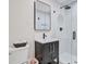 Modern bathroom with a glass shower, black hardware, and vanity with a vessel sink at 108 E Walker Dr, Summerville, SC 29483
